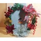 Round Christmas wreath with artificial fir, Christmas flowers and beaded ornament. Size 20 cm.