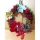 Round Christmas wreath with artificial fir, Christmas flowers and beaded ornament. Size 20-25 cm.