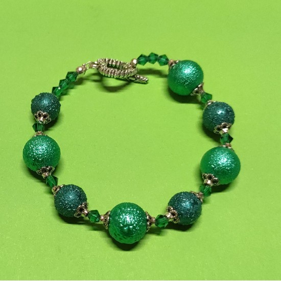 Bracelet about 21 cm made of glass pearls, stardust, pastel green and emerald green, green biconical faceted glass crystals