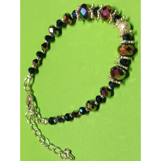 Semi-precious. Bracelet about 16 cm + 5 cm extension chain, with faceted glass beads, abacus rainbow, biconical rainbow glass beads, celestial silver-plated brass beads. Silver plated round studs and silver plated lobster clasps.