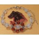 Natural amber bracelet with opalescent beads, length about 18 cm + 5 cm silver-plated extension. Made of silicone wire, natural amber, opalescent spheres, gold spacer with crystals, silver-plated spacer and silver lobster clasps.