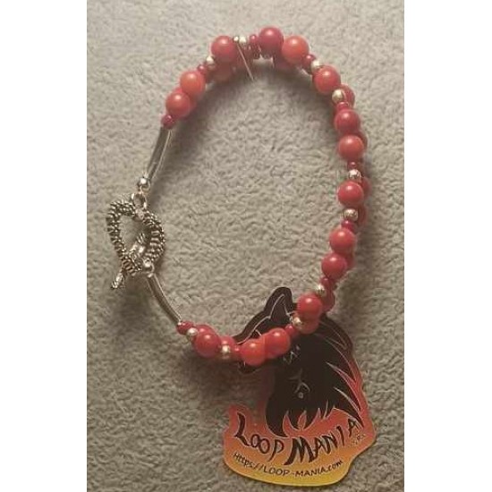 Two-string bracelet made of semi-precious coral beads and glass beads