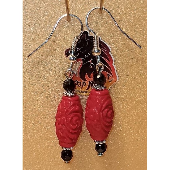 Earrings barrel cinnabar  and onyx spheres. Made of silver-plated needles and cakes, faceted onyx spheres, barrel cinnabar and silver-plated spacer spacer.