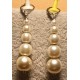 Glass and acrylic pearl earrings with stainless steel earrings.