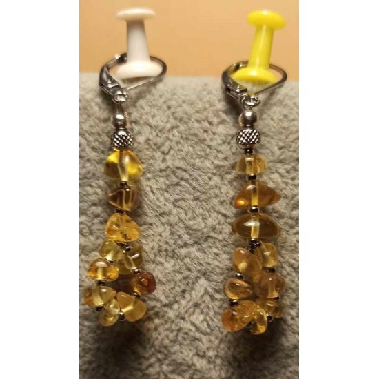 Earrings made of amber beads and stainless steel balls. 