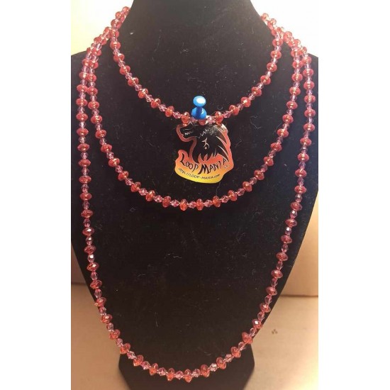 Necklace made of glass and acrylic beads, on siliconized wire, with stainless steel accessories having stainless steel lobster clasps with a 5 cm extension. 