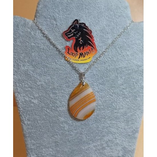 55 cm necklace with striped yellow agate pendant 40 / 45mm long, 28 / 30mm wide. (1pc) cm and silver plated accessories. Handmade on silicone wire, silver-plated lobster clasp.