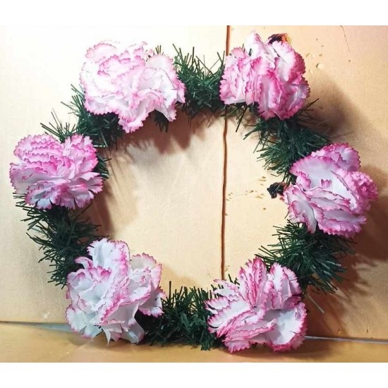 Fir wreath with artificial flowers, carnations.