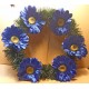 Fir wreath with artificial flowers, gerbera 11 cm, different colors.