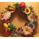 Easter wreath made of artificial fir tree and artificial flowers with polystyrene eggs, poisson and various Easter decorations. Size 20-23 cm.