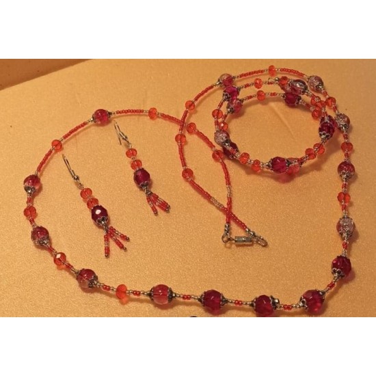 Set: necklace-bracelet. Necklace about 65 cm. Red glass beads, toho beads, Tibetan silver caps. 