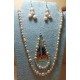Set: necklace-bracelet-earrings made of cultured peach pearls and glass beads. 