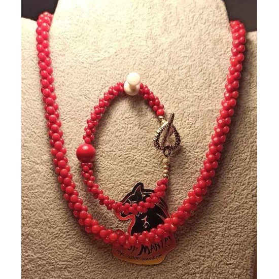Set: necklace--bracelet. Necklace and bracelet, made of semi-precious coral beads and glass beads with accessories plated with silver and Tibetan silver. with Tibetan silver toggle clasps.